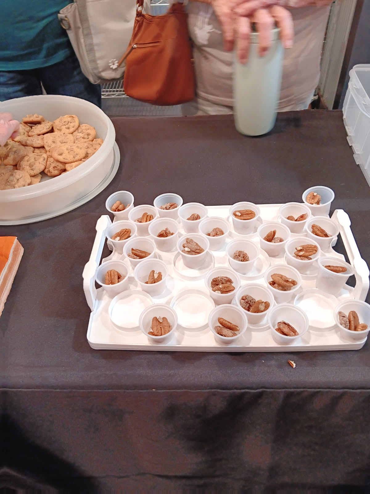 Sampling pecan products, including the sugar-and-cinnamon coated pecans